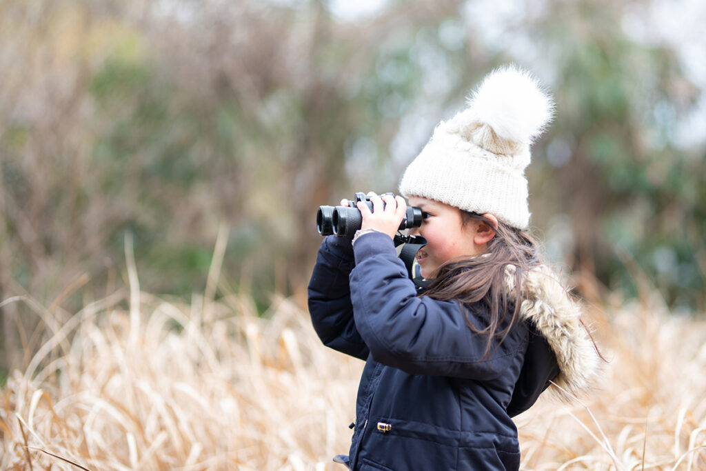 Little girl with binoculars