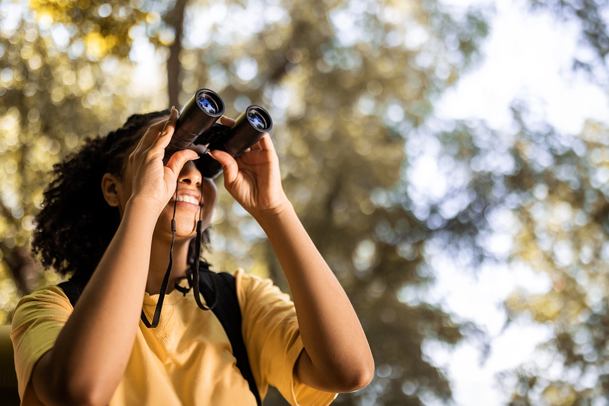 Young girl birdwatching