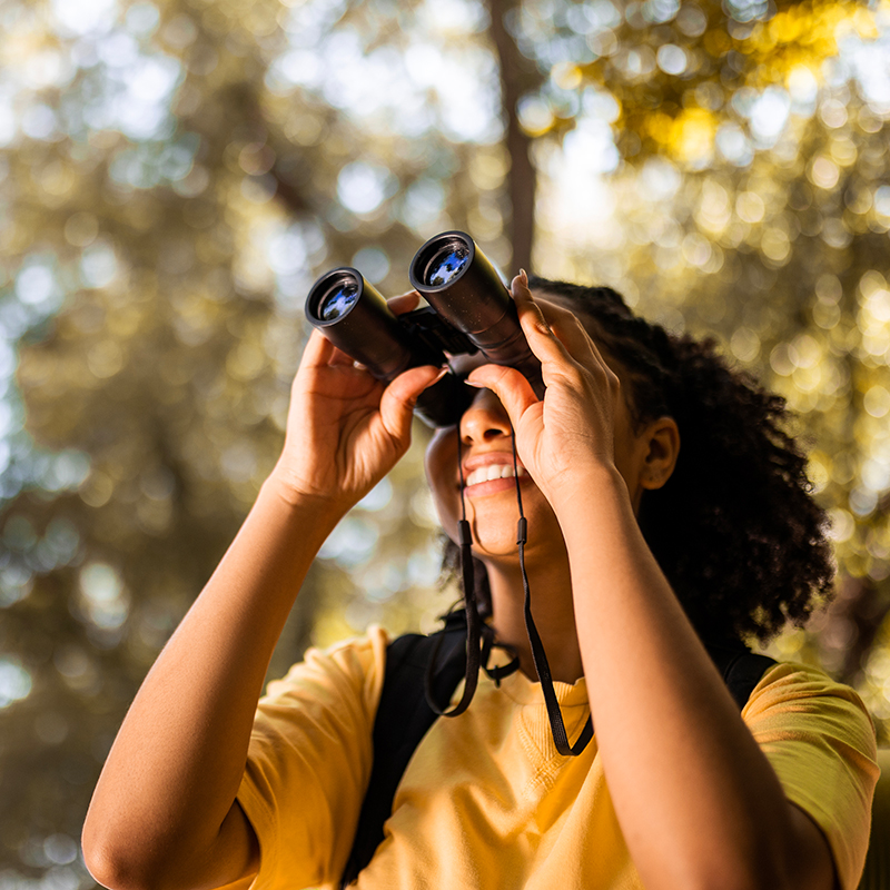 A young girl birding